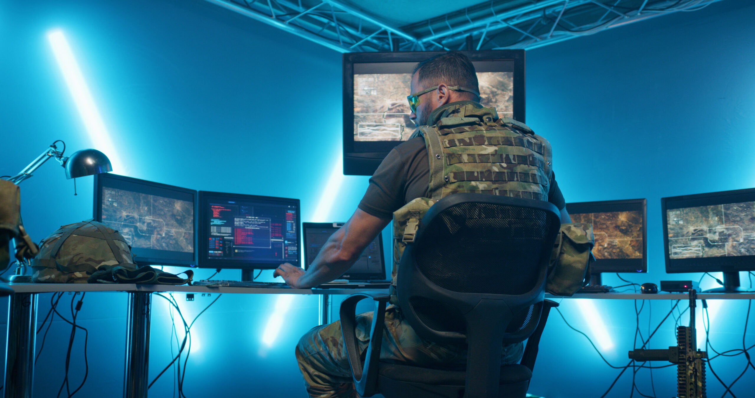 Military men working on computer systems while hiding in secret base of intelligence
