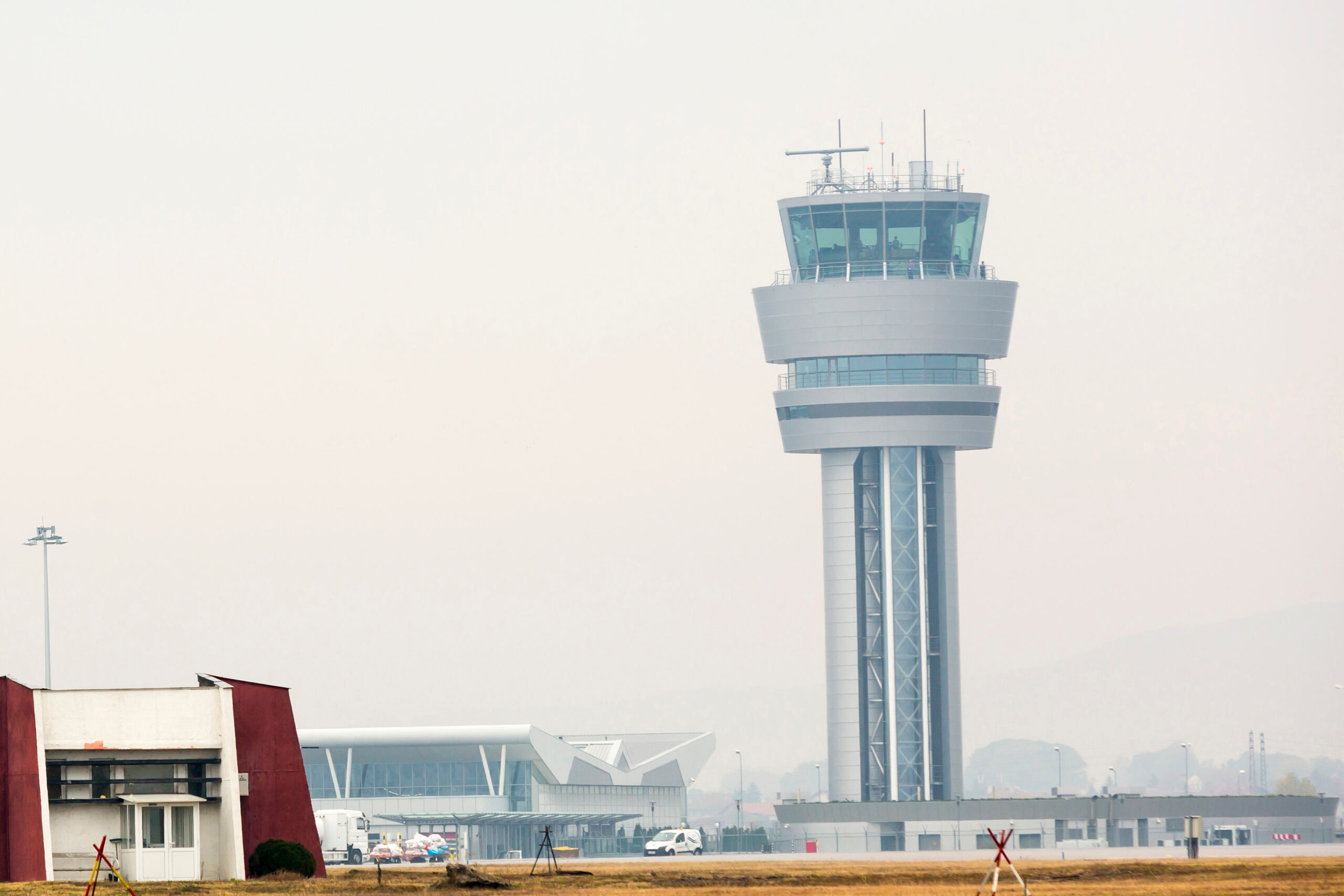 Airport control tower at Sofia's airport in a foggy weather.